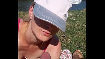 Play His wife sucks his dick while on the beach to tan his skin. The wife was scared because she was in public and she was scared not to be seen by others.